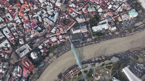 Aerial view of Tbilisi city central park and Bridge of Peace. Beautiful cityscape of old Tbilisi
