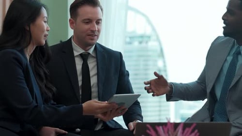 Diversity business people in ornamented office discussing business plan