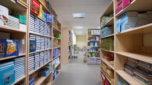 Bookshelves in university library. Interior of the library with shelves full of books