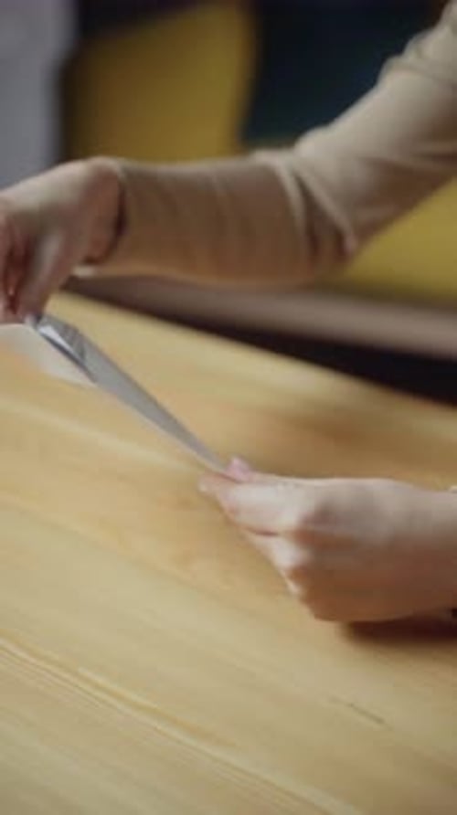 Hands Opening Letter and Unfolding Paperwork