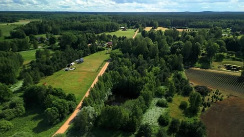 An Exquisite Aerial Perspective of the Picturesque Countryside Showcasing Lush Green Fields and