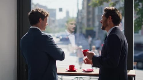 Happy Businessmen Coffee Break at Sunny City View Panoramic Window Cafe Closeup