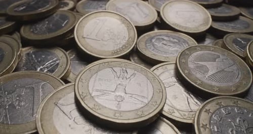 Detailed shot of many One Euro coins.