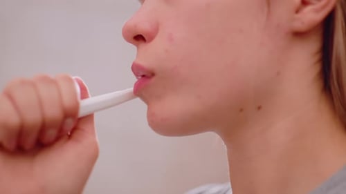 Close Up Young Woman Brushing Teeth During Morning Oral Hygiene