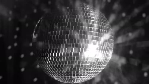 Bright disco ball reflecting light in a festive dance environment