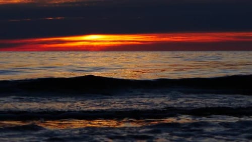 Red sunset by the calm sea
