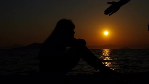 Father Give Hand to Child Silhouette By Sea