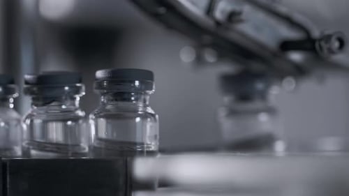 Medical Production for Drugs Supply of Pharmacy Industry Closeup. Manufacturing Bottle Row