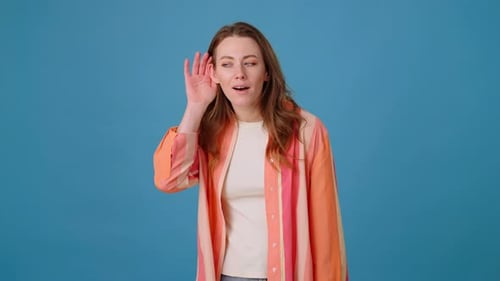 Woman Makes Sign with Hand to Lock Mouth to Keep Secret