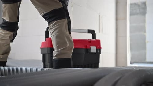 Industrial Worker Closing His Toolbox at Workplace