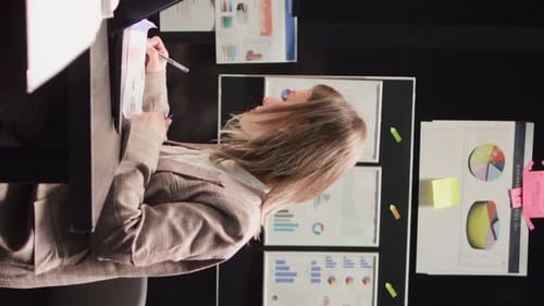Stressed Woman Working on a Computer in Office