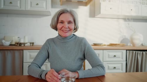 Senior Woman Smiling In Her Kitchen