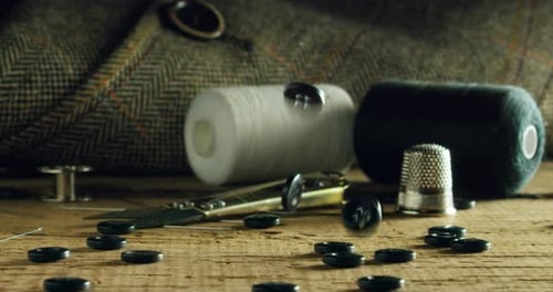 Buttons Falling Near Sewing Notions Still Life