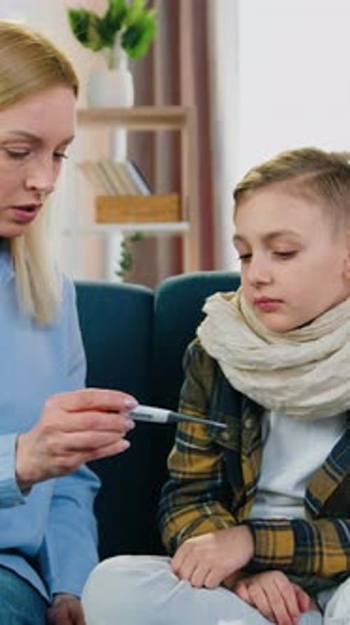 Motherhood and Childcare Concept Where Attractive Loving Caring Mom Measuring Body Temperature of