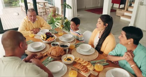 Family Enjoys a Meal Together at Home