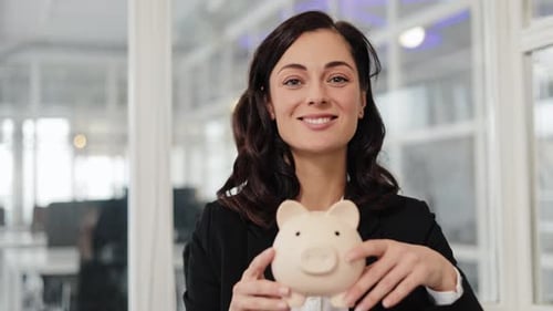Businesswoman Holding Piggy Bank Finance Savings and Investment Concept