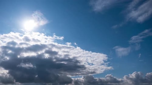 Clouds Moving in Bright Blue Sky Time Lapse