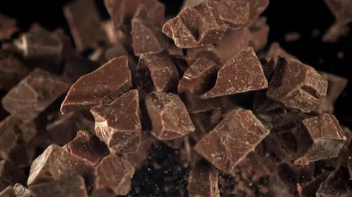 Chocolate Chunks Falling on a Black Background