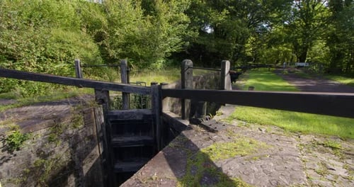 Closed lock gates at resolven lock on the neath canal at resolven