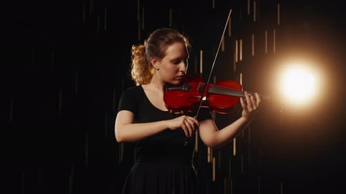Woman Playing Violin with Light Streaks