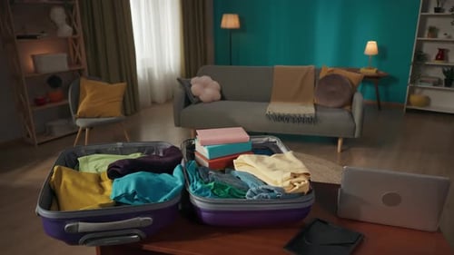 Suitcases Packed with Clothes in Cozy Living Room