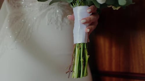 Bride Holding Wedding Bouquet with Diamond Ring