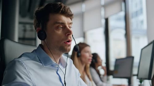 Closeup Technical Assistant Talking in Call Center Focused Man Listening Client