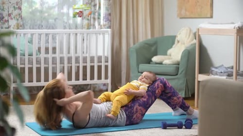 Woman Working Out with Infant at Home