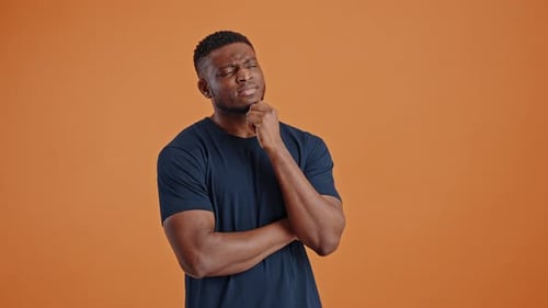 Thoughtful Young Adult Pondering Ideas Indoors