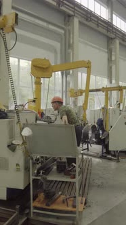 Industrial Worker Operating Lathe Machine in Factory Stock Clip