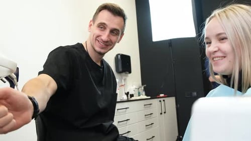 Consultation of a Dentist and a Female Patient