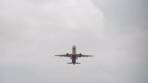 Front View Passenger Airplane in Cloudy Sky Aircraft Overhead Bottom View Jet Plane Flies for