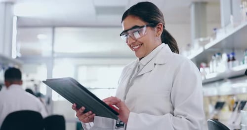 Woman Using Tablet in Modern Laboratory