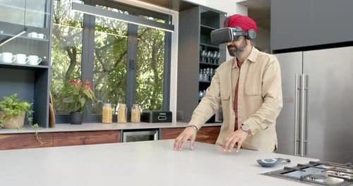 Man Uses VR Headset in Modern Kitchen