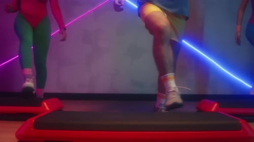 Aerobic Step Exercise with Neon Lighting