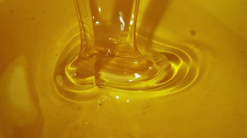 Golden Elixir Pouring Honey in a Mesmerizing Display