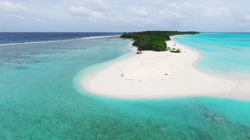 Aerial view of beach with turquoise water and white sand, Maldives.