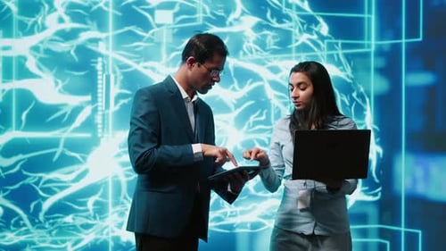 Colleagues Using AI Technology in a Futuristic Office