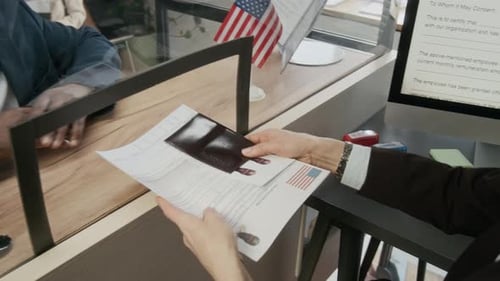 Man Submits Passport for Visa at Immigration Office