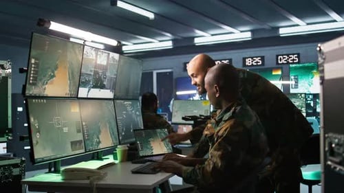 Adults Analyzing Data in High-Tech Facility