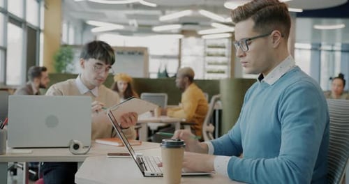 Adults Working Together in a Modern Office