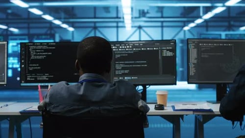 Wheelchair User and Multiethnic Team Working Together in Data Center