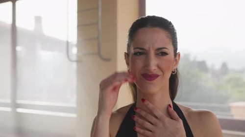 Woman Experiencing Pain and Discomfort Indoors