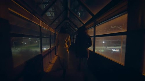 Lifestyle Portrait of Two Young Women Watching Tower Building Together