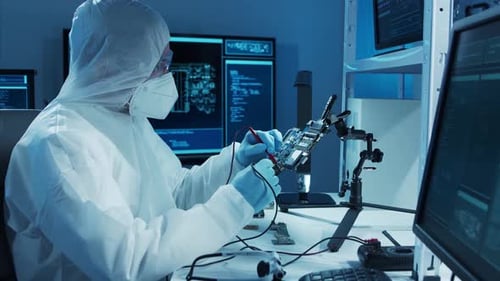 Microelectronics Engineer Works in a Modern Scientific Laboratory on Computing Systems and