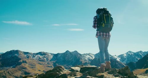 Backpacker on Mountain Top Enjoy Vacation Travel Successfully Raise Hands