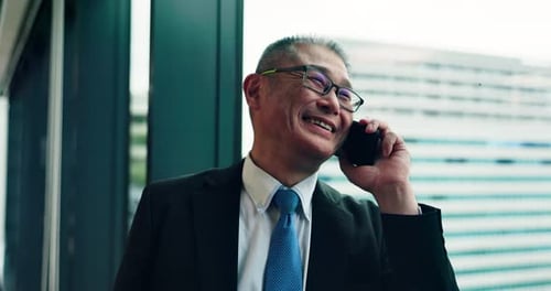 Mature businessman, phone call and window in office with smile, contact
