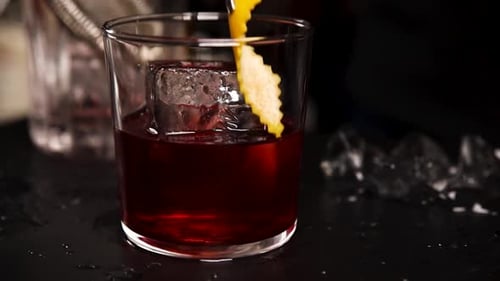 the bartender prepares a cocktail at the bar