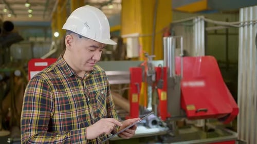 Engineer Asian Man Worker Heavy Industry Plant Factory Tablet Pipe Manufacture Machinery