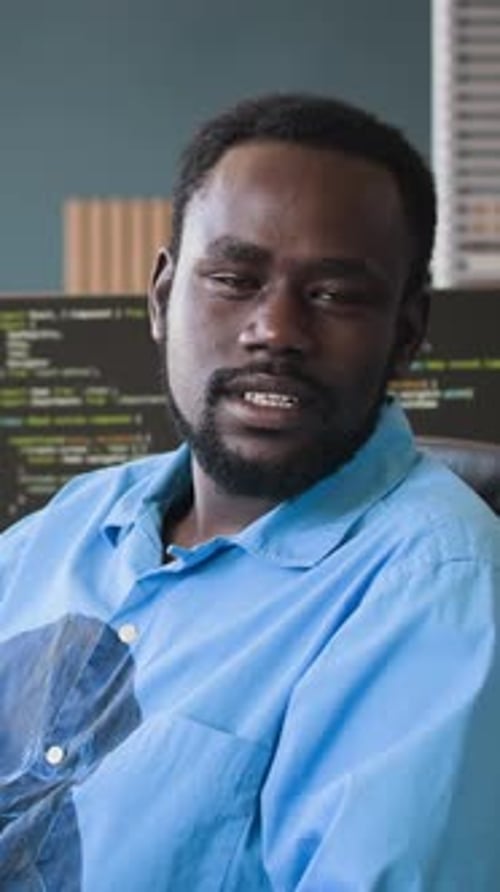 Young Black Programmer Speaking During Video Call